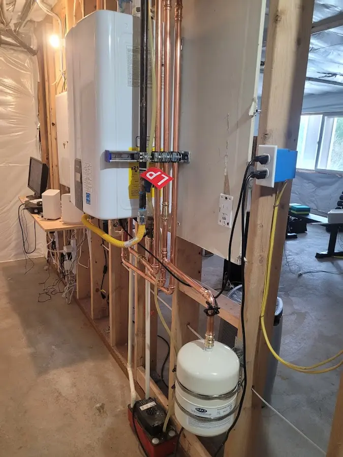 Licensed plumber repairing a kitchen sink in Chester